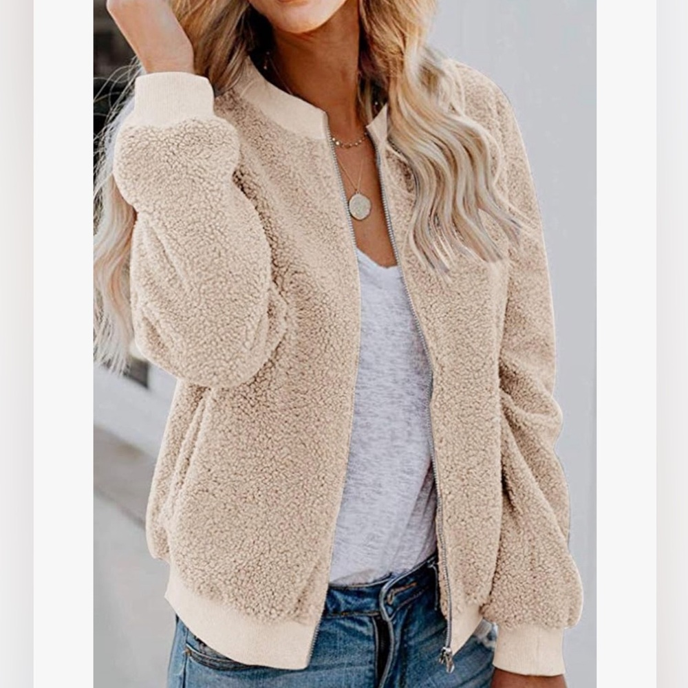 NWOT Mirol cream colored sherpa zip jacket.  Excellent  condition.
